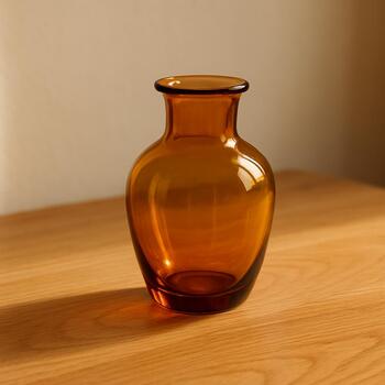 Small amber glass vase on oak step