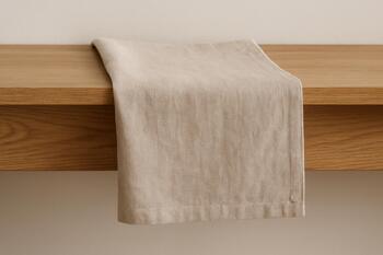 Linen runner over an oak shelf