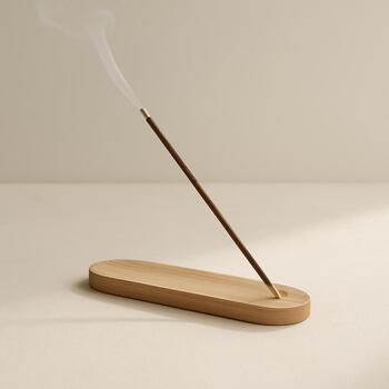 Thin incense stand with gentle smoke