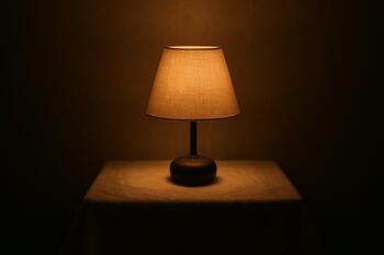 Small table lamp with linen cloth below