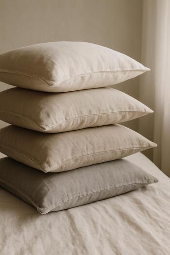 Stack of linen pillows in muted tones