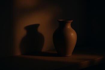Vase casting a long soft shadow