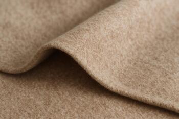 Wool edge on a gentle bias fold